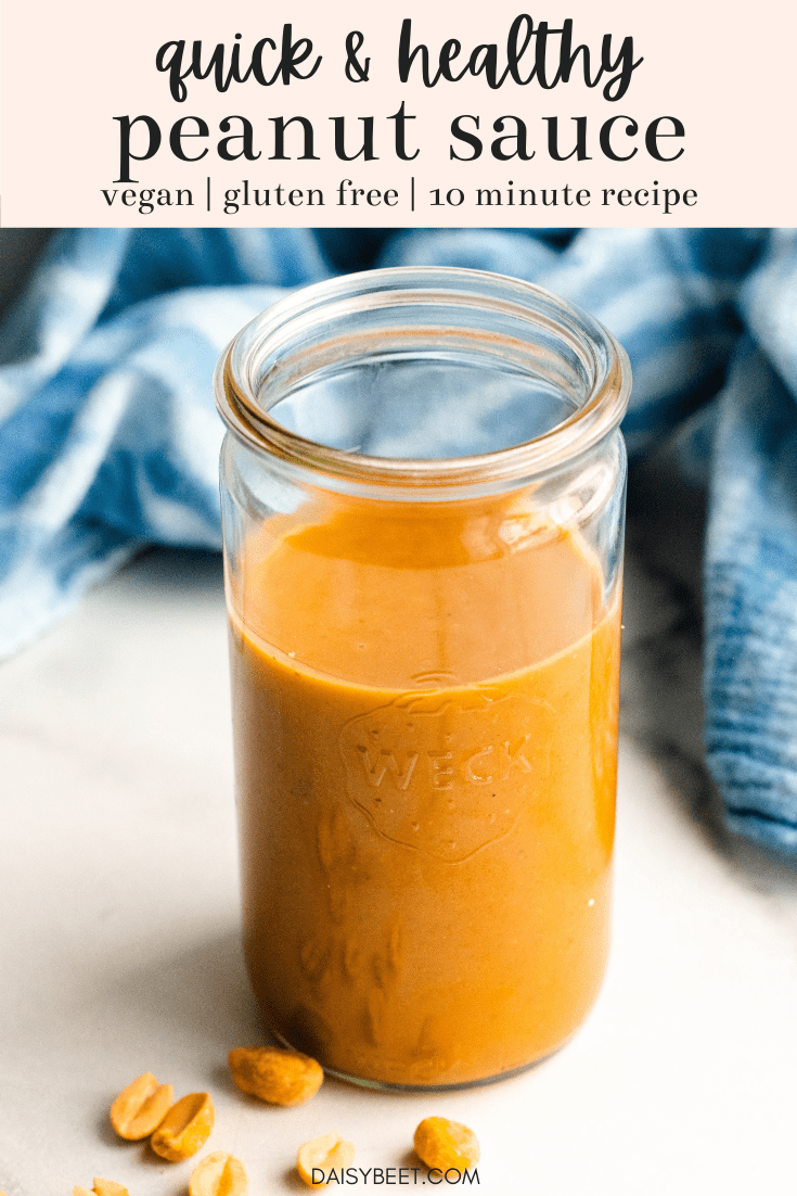 Jar of homemade peanut sauce with blue towel in the background
