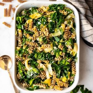 Baked Goat Cheese Spinach Artichoke Pasta in a rectangular white baking dish