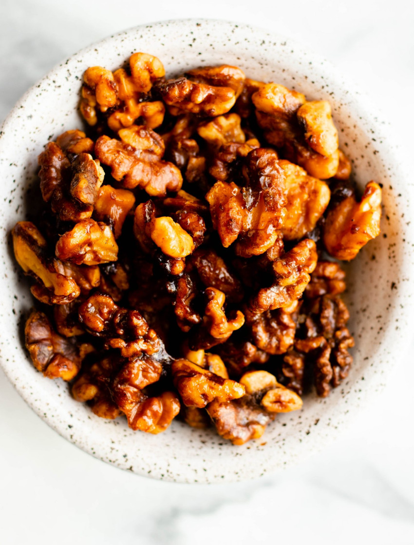 Close up of bowl of maple spice roasted walnuts