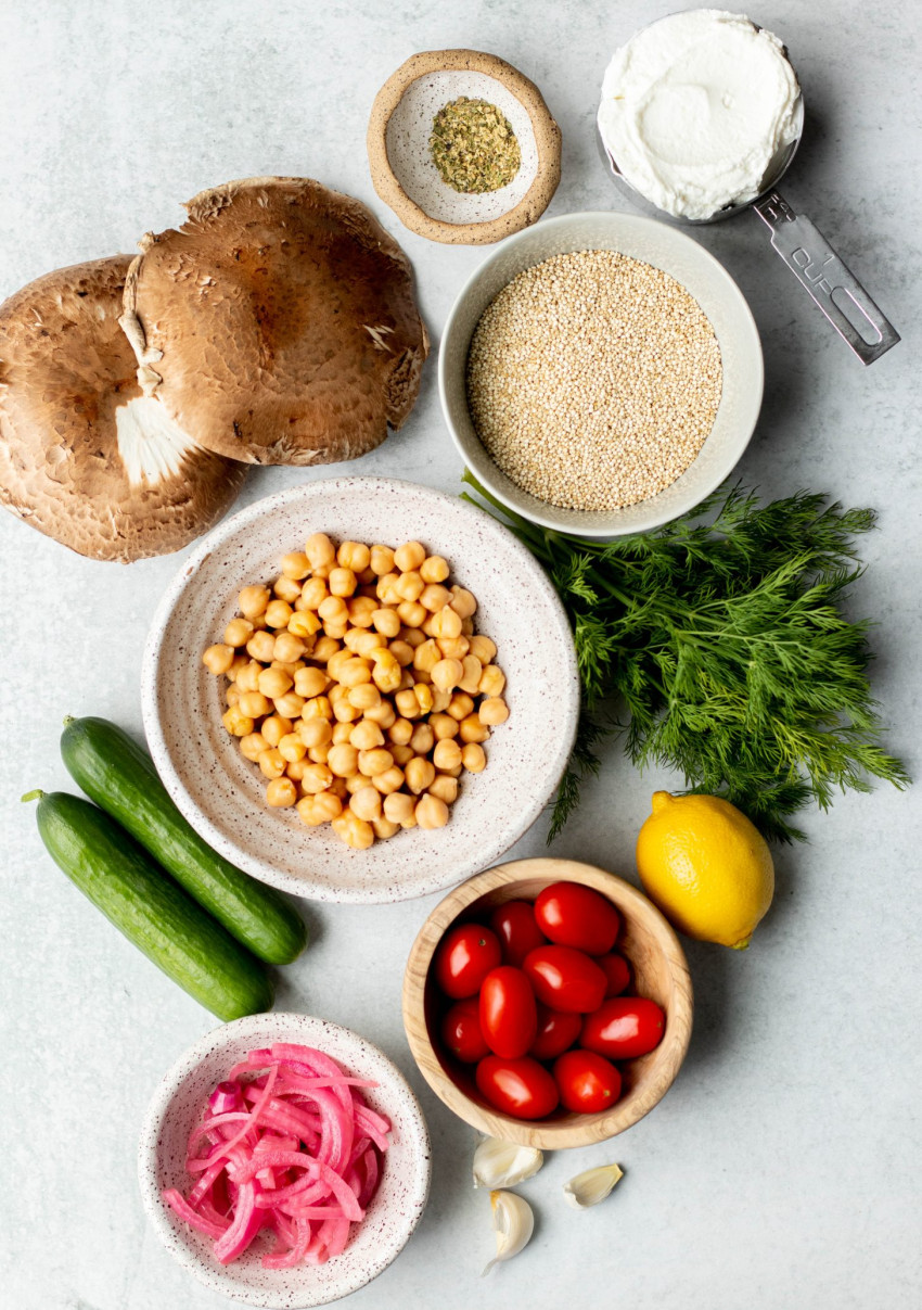 Vegetarian gyro bowls ingredients measured out on a grey backdrop