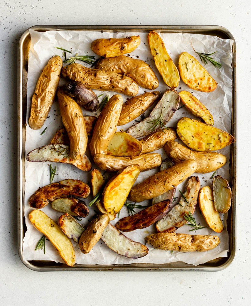 Air fryer tray with roasted fingerling potatoes and rosemary