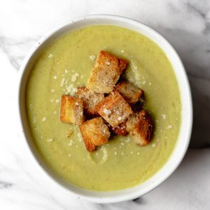 bowl of broccoli leek soup with croutons