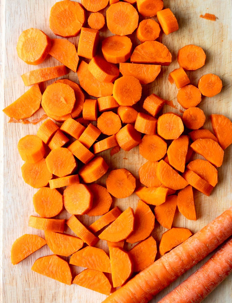Chopped carrots on a wooden cutting board