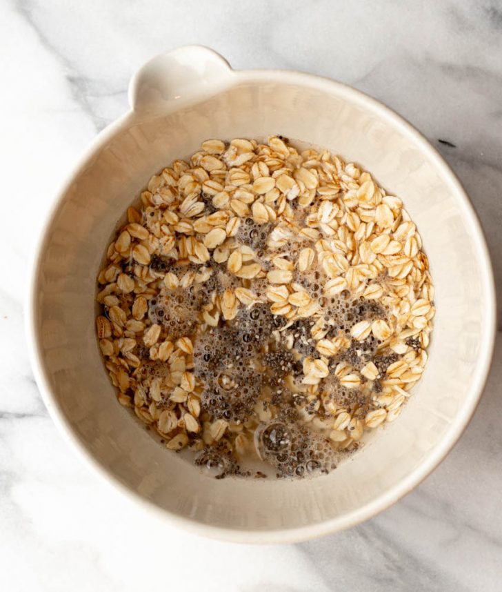 oatmeal and chia seeds in a bowl with water before being cooked