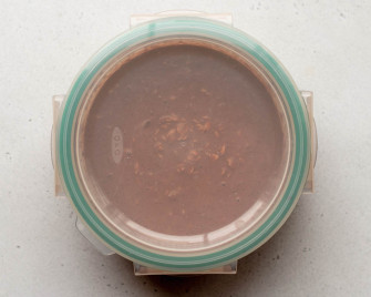 chocolate peanut butter overnight oats in a circular container with a lid