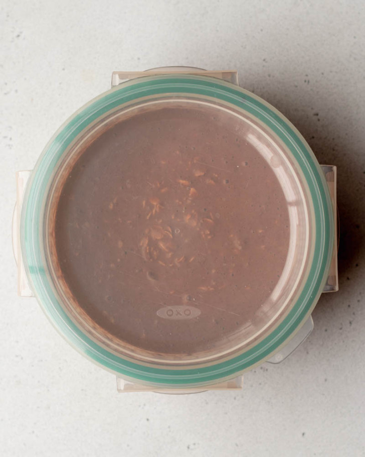 chocolate peanut butter overnight oats in a circular container with a lid
