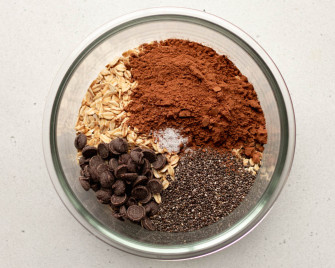 Chocolate peanut butter overnight oats dry ingredients in a small glass circular container
