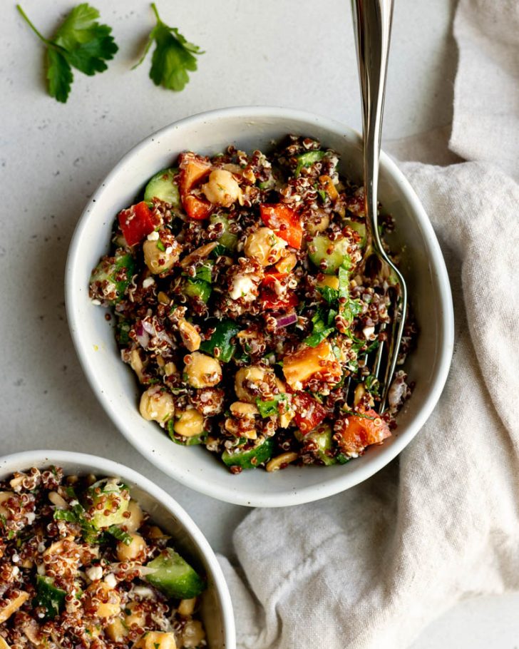 small bowl of red quinoa salad with a fork 