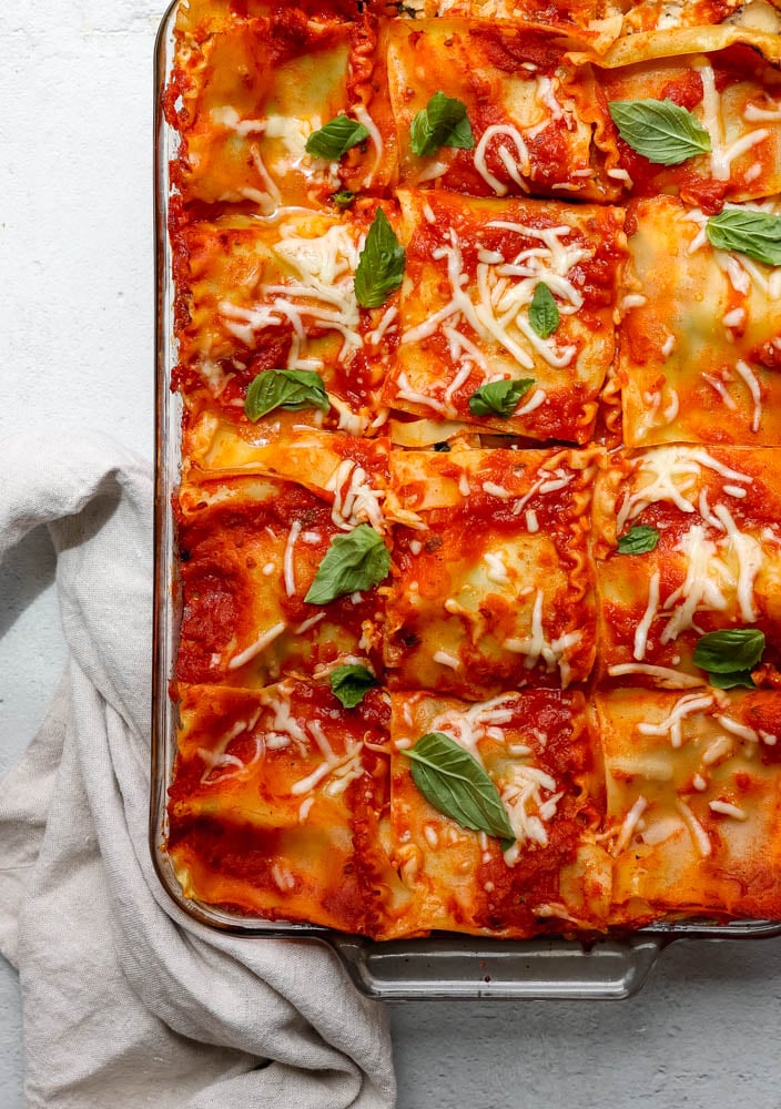glass baking dish with lasagna cut into squares