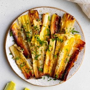 speckled white plate of roasted leeks