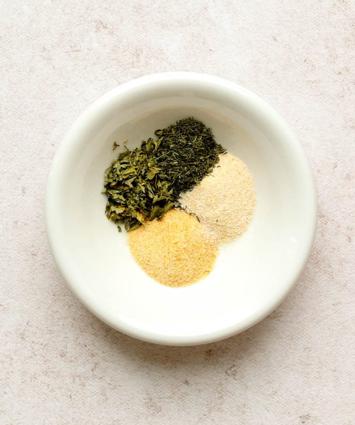 4 dried seasonings in a small white dish