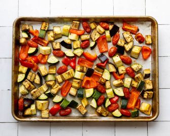 Roasted mixed vegetables on a baking sheet