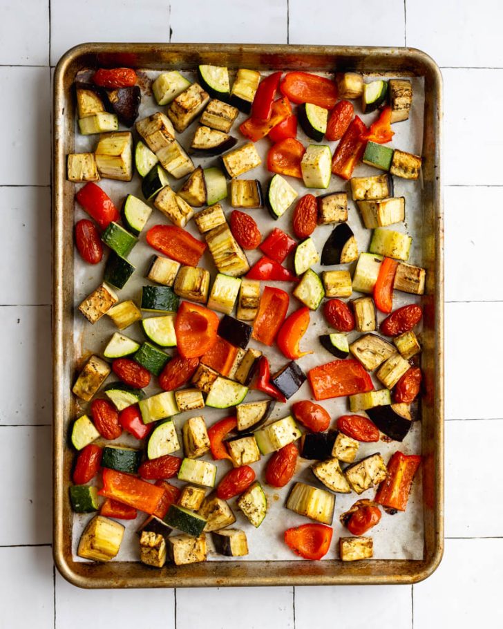 Roasted mixed vegetables on a baking sheet