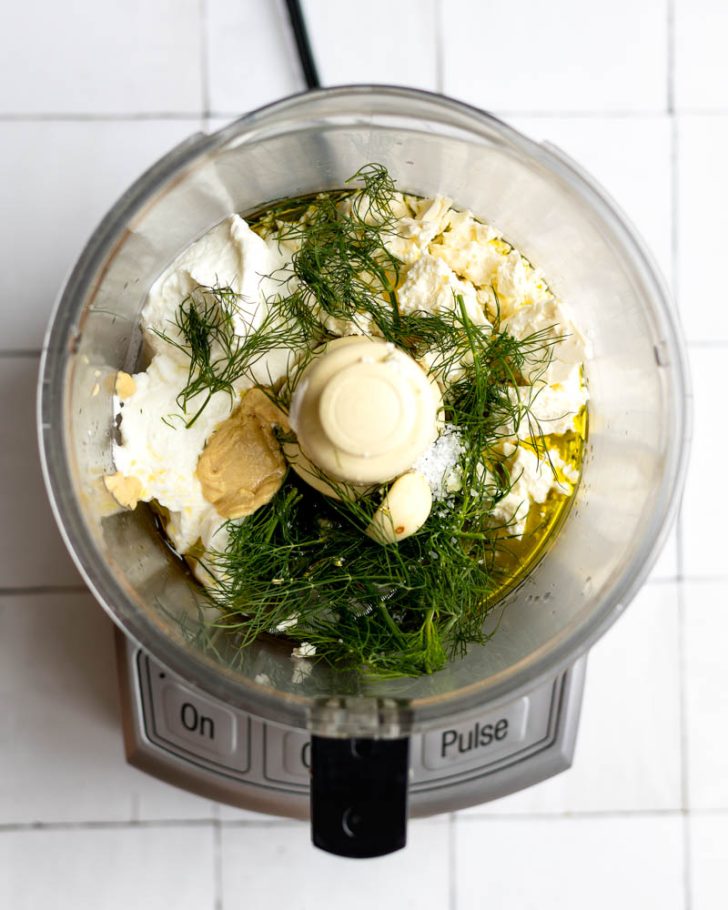 Feta dill dressing in a food processor before being blended