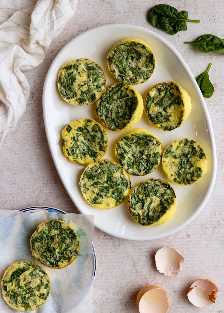 platter with cottage cheese egg bites next to plate with 2 egg bites