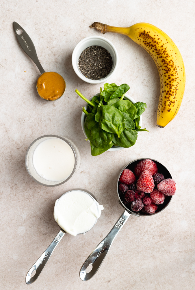smoothie with greek yogurt and frozen fruit ingredients measured out