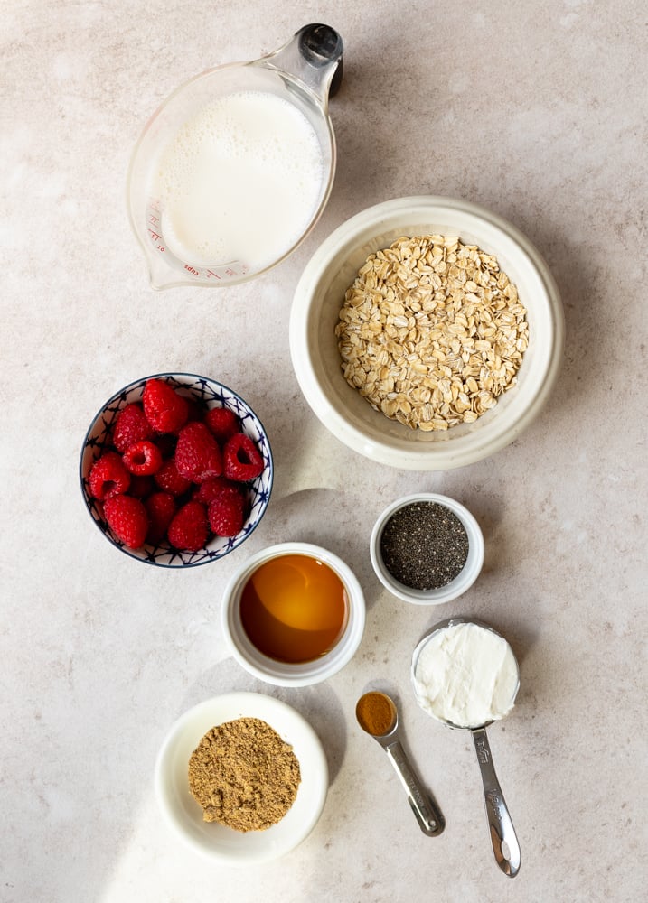 high fiber overnight oats ingredients measured out on light backdrop