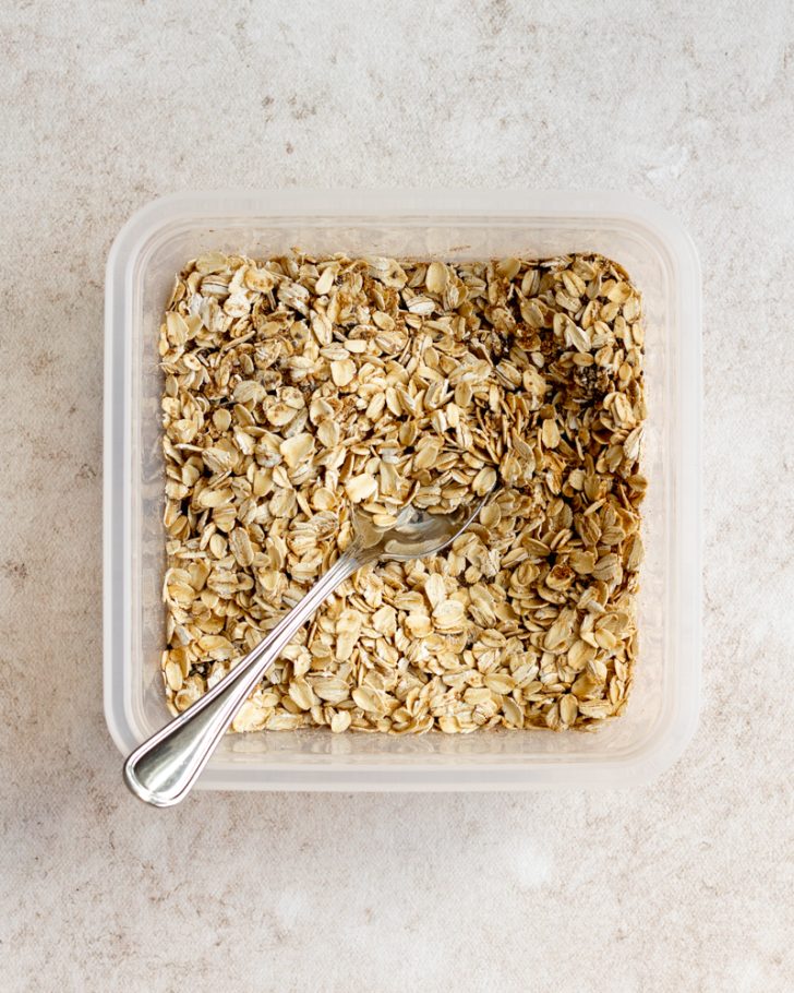 dry ingredients overnight oats in a square tupperware container