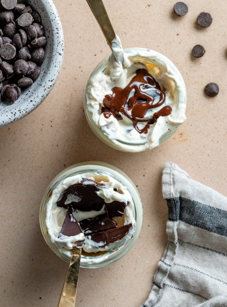 two cups of greek yogurt peanut butter dessert with chocolate
