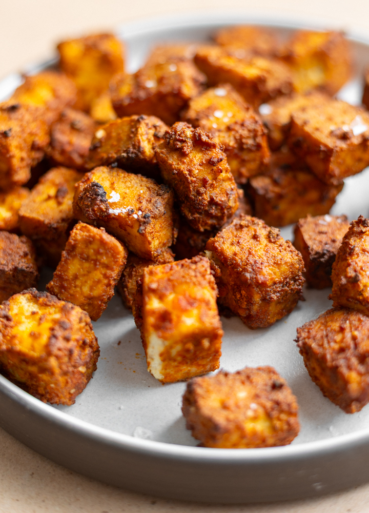 air fryer tofu cubes on a ceramic plate