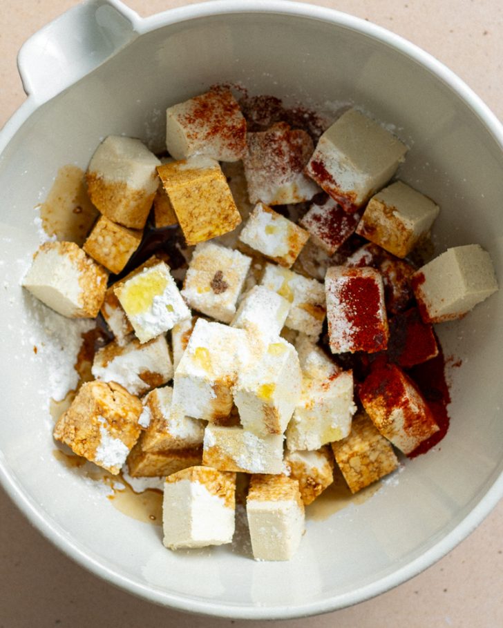 tofu and seasonings in a mixing bowl