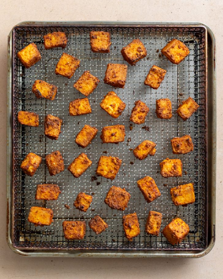 air fried tofu on an air fryer basket