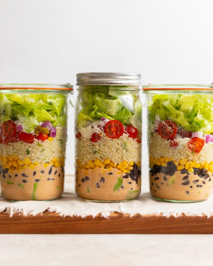 three taco quinoa salads in jars